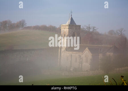 Misty winter morning Church of St Mary's at Crosthwaite  the Lyth Valley between Kendal and Bowness On Windermere Lake District  Cumbria England Stock Photo