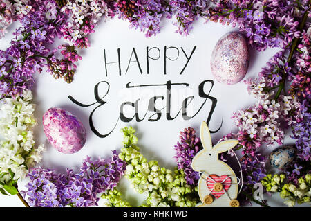 Happy Easter card with spring flowers and painted eggs Stock Photo