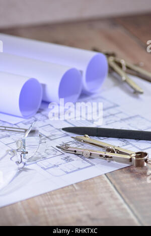 Architects drawings on a wooden table Stock Photo