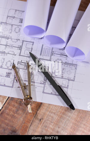 Architects drawings on a wooden table Stock Photo