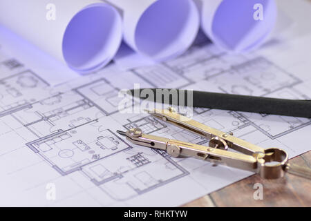 Architects drawings on a wooden table Stock Photo
