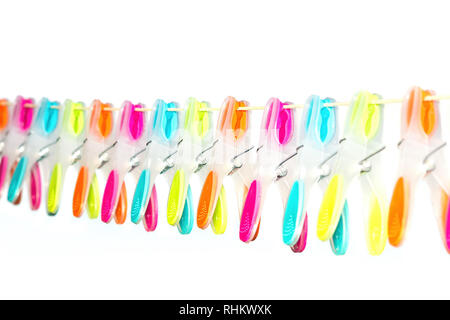 Row of colored clothespins hanging on washing line Stock Photo