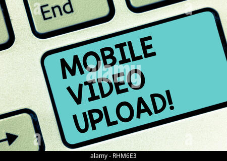 Word writing text Mobile Video Upload. Business concept for add videos on website or blog using cell phone Keyboard key Intention to create computer m Stock Photo