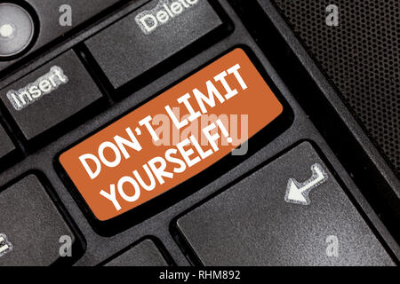 Word writing text Don T Limit Yourself. Business concept for Selfcontrol moderation underestimate you Stop Afraid Keyboard key Intention to create com Stock Photo