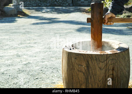 Pounding mochi early in the morning before the new year, a Japanese tradition Stock Photo