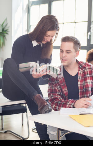 Two students checking information and knowledge while learning together Stock Photo