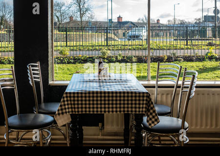 Empty cafe seats and tables in a cafe at Doncaster, England Stock Photo