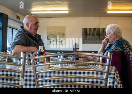 Middle aged couple sitting in a cafe in Doncaster, England Stock Photo