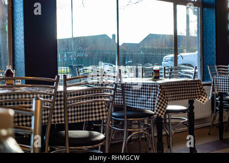 Empty cafe seats and tables in a cafe at Doncaster, England Stock Photo