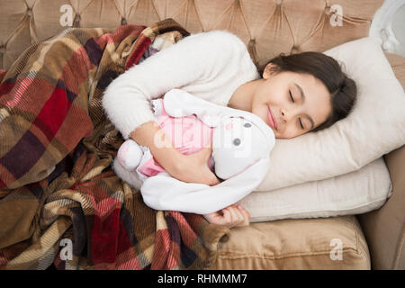 small girl child. Sweet dreams. happy little girl sleep in bed. family and love. childrens day. Childhood happiness. Good night. Good morning. Child care. Sunday fun. Stock Photo