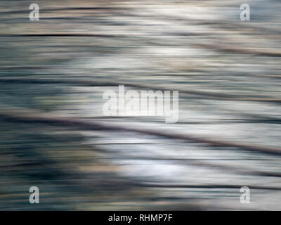 Abstract background from stream, running water and intentional camera movement for blurry effect. Light and shade. Stock Photo