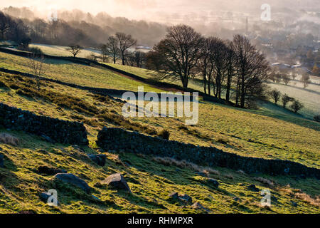 Bamford village shrouded in a mist inversion, from New Road below Bamford edge (1) Stock Photo