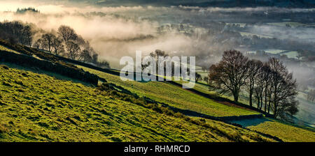 Bamford village shrouded in a mist inversion, from New Road below Bamford edge (6) Stock Photo