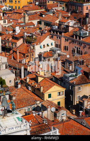 View from the Campanille tower to the red and orange Venice rooftop cityscape Stock Photo