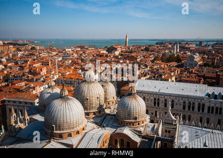 Panoramic view from the Campanile tower to the Venice rooftop cityscape and copules of St Mark's Basilica Stock Photo
