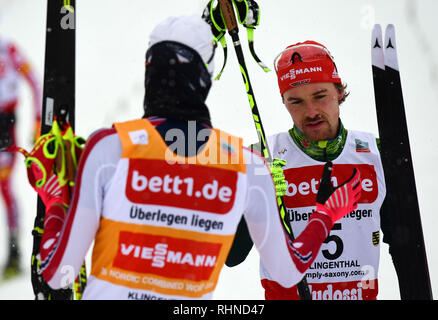 Klingenthal, Germany. 03rd Feb, 2019. Nordic Combined, World Cup, Single, Large Hill, 10 km. Fabian Rießle (r) from Germany congratulates winner Jarl Magnus Riiber from Norway at the finish. Credit: Hendrik Schmidt/dpa-Zentralbild/dpa/Alamy Live News Stock Photo