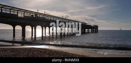 Boscombe, Dorset, UK. 3rd February 2019.  UK Weather:  Bright and sunny winter's morning at Boscombe beach. The  famous pier is silhouetted against the bright morning sunshine at the English coastal resort of Boscombe. Credit: DWRAlamy Live News Stock Photo