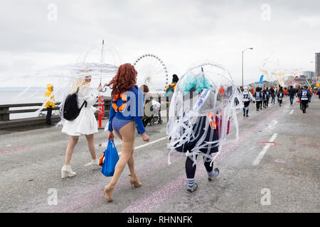 Seattle, Washington, USA. 2nd February, 2019. The Hello/Goodbye Drag Queens walk in a procession along the closed Alaskan Way Viaduct. An estimated 70,000 people attended the Hello Goodbye: Viaduct Arts Festival as part of the grand opening of the state-of-the-art tunnel spanning two-miles under downtown. The festival, which took place on the elevated highway, began with a processional featuring music and performances from regional artists and organizations. Credit: Paul Christian Gordon/Alamy Live News Stock Photo