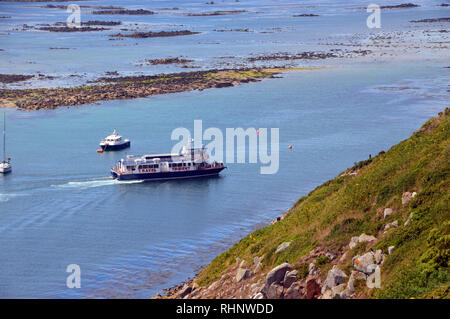 The Travel Trident Ferry Arriving at Rosiere Steps on Herm Island from St Peter Port, Guernsey from the Coastal Path, Channel Islands.UK. Stock Photo