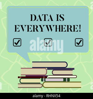 Word writing text Data Is Everywhere. Business concept for Information raw or unorganized form refer conditions idea Uneven Pile of Hardbound Books an Stock Photo