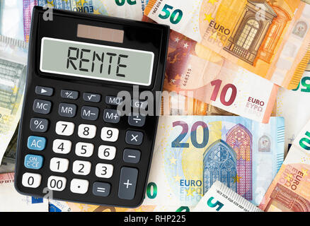 German word RENTE (pension) on display of pocket calculator against paper money Stock Photo