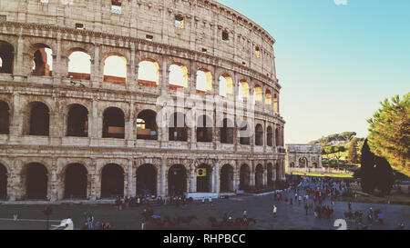 Roman Colosseum and Tourists Early Morning in Rome, Italy Stock Photo