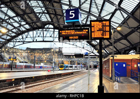 Train arriving at Liverpool Lime Street railway station at dusk in winter Stock Photo