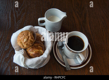 Freshly baked rolls and coffee at a restaurant in Bangkok, Thailand Stock Photo