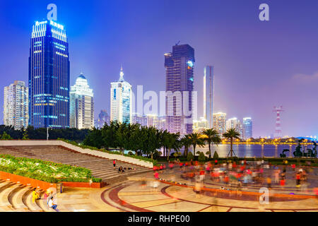 XIAMEN, CHINA -OCTOBER 08: Night view of city skyscrapers and park public square at Bailuzhou park in the downtown area on October 08, 2018 in Xiamen Stock Photo