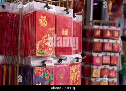 Red pockets seen on sale during the preparations. It is tradition to place inside the envelope money and give as a gift to family and friends during the new year celebrations. The former British colony of Hong Kong is preparing for the Lunar Chinese New Year 2019. People in the city are busy decorating to welcome the year of pig. Stock Photo