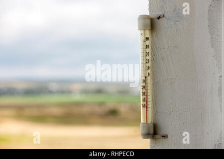 Thermometer on wall outside,wall thermometer, temperature measurement,  outdoor temperature, weather conditions Stock Photo - Alamy