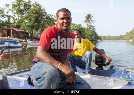 Miches, El Seibo, Dominican Republic - May 23, 2015: Motor boat drivers on river in Miches. Stock Photo