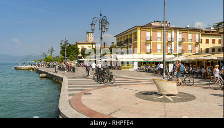 LAZISE, LAKE GARDA, ITALY - SEPTEMBER 2018: People on the promenade in Lazise on Lake Garda. Stock Photo