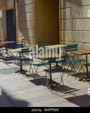 Empty street restaurant on the old town street of Perpignan, France Stock Photo