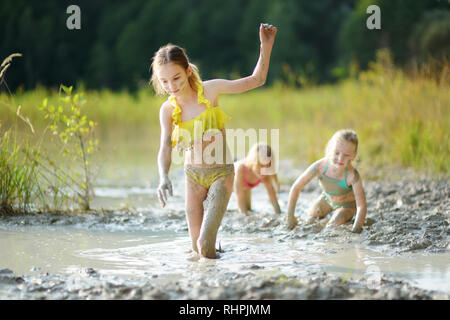 Three Young Sisters Taking Healing Mud Baths On Lake Gela Near Vilnius 