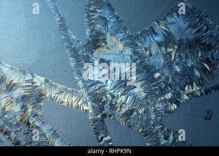 Frost on window pane on cold day Stock Photo