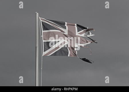 old faded union jack flag flying in wind in sun Stock Photo - Alamy