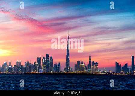 Dubai, United Arab Emirates - January 10, 2019: Beautiful winter sunset over Dubai panorama landmark view from the Dubai creek harbor