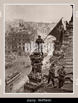 RUSSIAN FLAG BERLIN 1945 REICHSTAG ICONIC World War 2 Germany. Russian soldier raising Soviet Hammer and Sickle flag over the Nazi Reichstag Chancellory Russian Flag, a historic World War II photograph, taken during the Battle of Berlin on 2 May 1945. It shows Soviet Union Troops Meliton Kantaria and Mikhail Yegorov raising their flag over the former Nazi seat of power, the Berlin Reichstag Berlin Germany