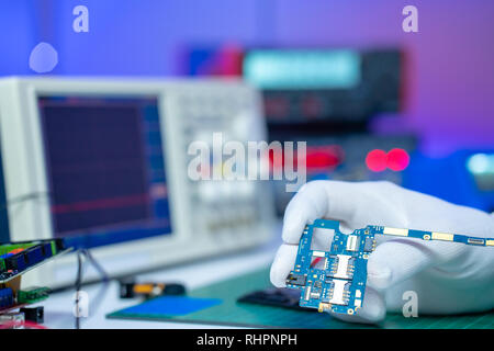 Fix of mobile phone in lab Stock Photo