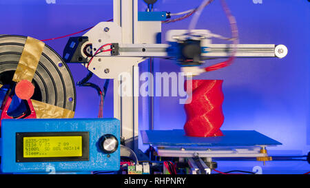 3d printer in action. Modern 3D printer printing figure Stock Photo