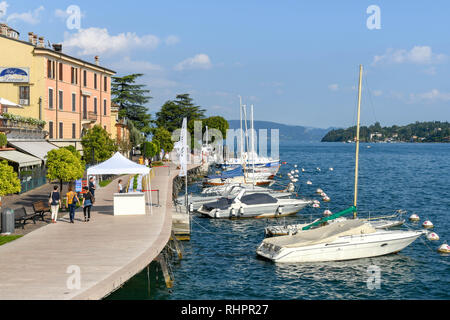 SALO, ITALY - SEPTEMBER 2018: People walking along the promenade in Salo on Lake Garda. Stock Photo