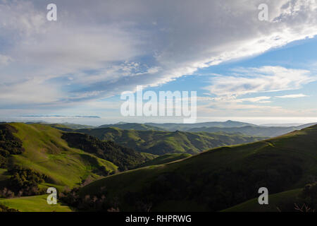 Valley green from recent rain with interesting cloud formation. Stock Photo