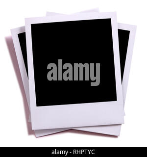 Untidy stack of three blank instant camera photo prints Stock Photo