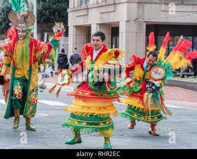Bolivian men in traditional costumes celebrating the plurinational