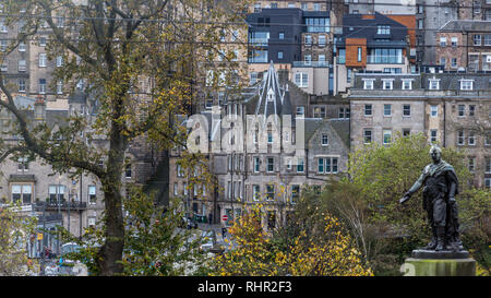 David Livingstone's grand statue by sculptor Amelia Robertson Hill foregrounds the view from Princes Street Gardens towards Market Street in Edinburgh Stock Photo