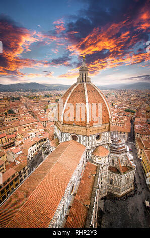 The Duomo in Florence, the Cathedral of Santa Maria del Fiore with beautiful lights from the top at sunset in Florence, Italy