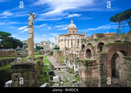 Panoramic image view of Ruins of Roman Forum, also known as Foro di Cesare, or Forum of Caesar, in Rome, Italy, on a bright summer day. on Capitolium Stock Photo