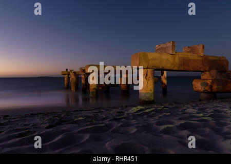 Long exposure of the old jetty /pier on a calm summer night in Jurien Bay Western Australia Stock Photo