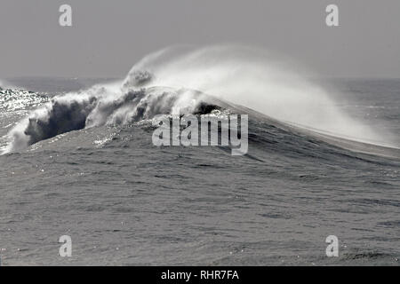 Interesting detailed view of a beautiful big white crashing wave in a stormy day at noon Stock Photo